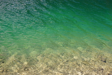 Fototapeta na wymiar Blue clear vivid water view from above