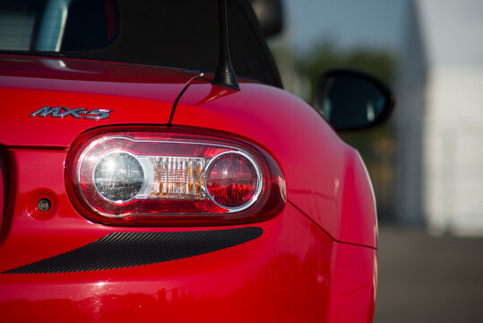 Mulhouse - France - 12 September 2020 - Closeup of rear light of red Mazda MX5 parked in the street