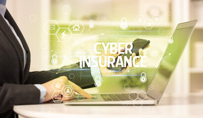 CYBER INSURANCE inscription on laptop, internet security and data protection concept, blockchain...