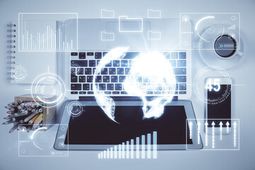 Stock market chart and top view computer on the table background. Multi exposure. Concept of financial analysis.