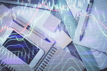 Multi exposure of forex graph hologram over desktop with phone. Top view. Mobile trade platform concept.