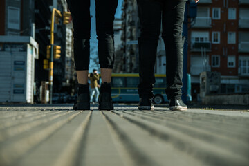 woman and men feet on the street, concept of couple, unity, city campaign, couple advertising
