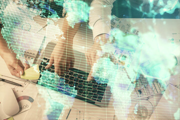 Double exposure of man and woman working together and business theme hologram drawing. Computer background. Top View.