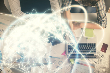 Double exposure of man and woman working together and business theme hologram drawing. Computer background. Top View.