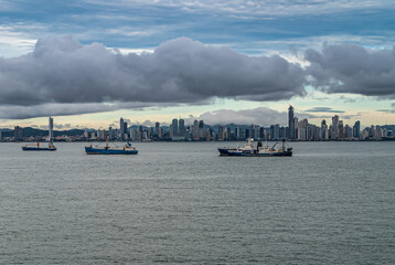 Panama City, Panama - November 30, 2008: Wide shot, from the bay with ships anchored, of modern...