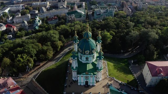 Orthodox Church on green hill in the city Kyiv, Ukraine. Aerial View of St. Andrews Church in the morning