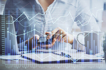 Double exposure of forex chart sketch hologram and woman holding and using a mobile device. Financial market concept.