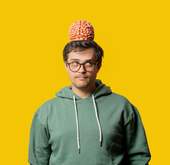 Guy in green hoodie with brain on yellow background