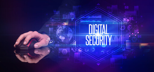 hand holding wireless peripheral with DIGITAL SECURITY inscription, cyber security concept