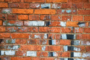 Fototapeta premium Background of brown bricks painted with paint. Building background made of bricks. The brick wall is brown. The wall of the old house.