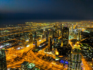 View of the from up high at night with the city lights