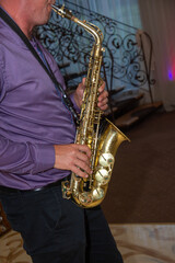 Fototapeta premium Man plays the saxophone