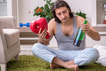 Male ex-champion boxer suffering from alcoholism at home