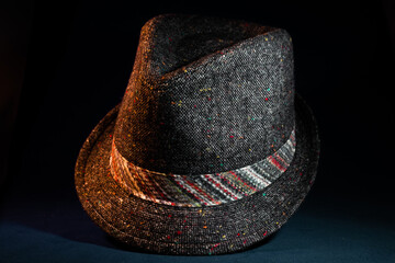 Multicolored Gray Heathered Fedora on Teal Backdrop
