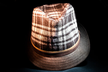 Brown and White Checkered Fedora in Darkness Facing Forward