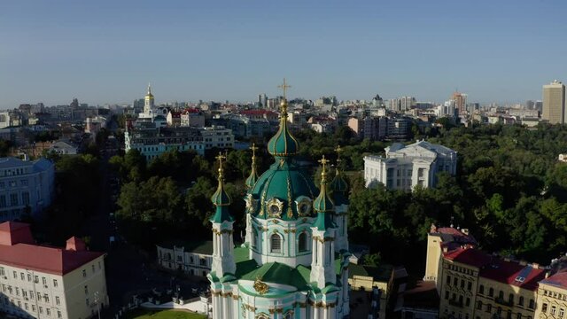 Orthodox Church on green hill in the city Kyiv, Ukraine. Aerial View of St. Andrews Church in the morning