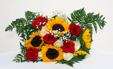 bouquet of colorful spring flowers. sunflower, roses, gerber
