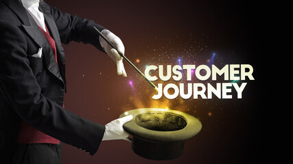 Illusionist is showing magic trick with CUSTOMER JOURNEY inscription, new business model concept