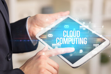 Close-up of a tablet searching CLOUD COMPUTING inscription, modern technology concept