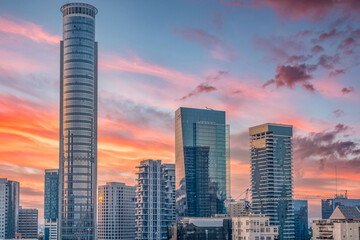 Tel Aviv sky scrapers financial district with colorful dramatic sunset sky in Israel