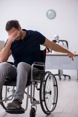 Obraz premium Young man in wheel-chair visiting dead doctor