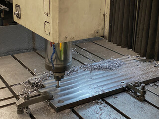 CNC 3 axis machine are working process on metal factory,Industrial metal work process at steel structure industry.