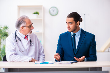 Male doctor and businessman discussing medical project