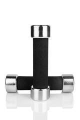 Two dumbbells on white background isolated close up with reflection, metal barbells set, pair of iron fitness bar-bells, sport equipment, bodybuilding concept, healthy lifestyle, gym training, nobody