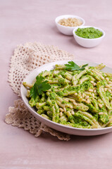 Traditional pasta with green sauce