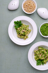 Traditional pasta with green sauce