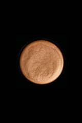 Earth tone make up colour powder on black background