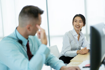 Group of happy business people in their work place.