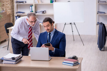 Two employees in the office