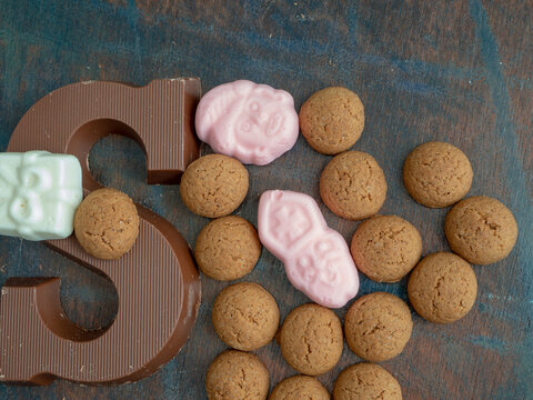 Composition for the dutch fest of Sinterklaas. With Dutch candy called pepernoten, schuimpjes and a chocolate letter S. Room for copy. 