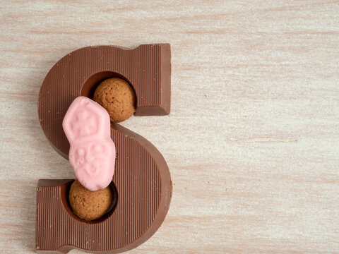 Composition for the dutch fest of Sinterklaas. With pepernoten and a chocolate letter S. Room for copy. 