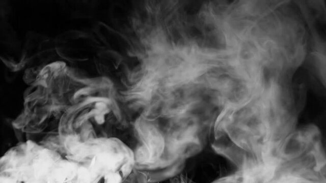 Texture of white smoke on a black background. Slow motion. Vape smoke. cigarette smoke clud.