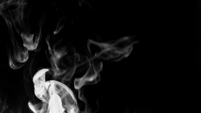 Texture of white smoke on a black background. Slow motion. Vape smoke. cigarette smoke clud.