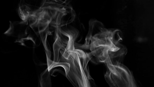 Texture of white smoke on a black background. Slow motion. Vape smoke. cigarette smoke clud.