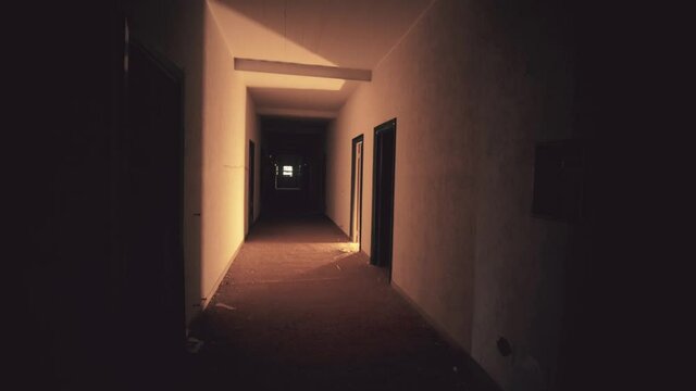 Dark mysterious corridor in an abandoned building. 4k