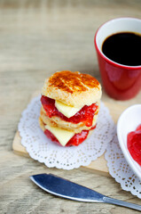 Close up of Scone dessert stack with cup for coffee