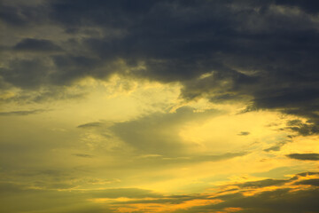 Clouds in soft yellow tones with dusk 
