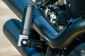 Closeup of a motorcycle parked in the historical streets of Reims, a city in the Grand Est region of France 
