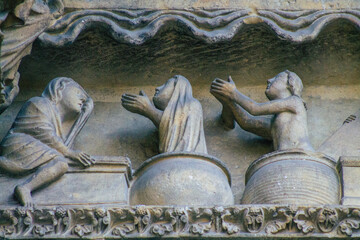 View of the exterior facade of the Roman Catholic Notre Dame de Reims Cathedral, a historical...