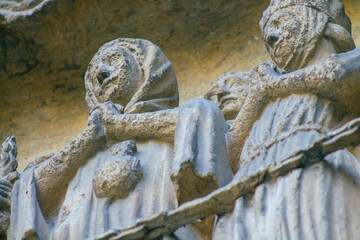 View of the exterior facade of the Roman Catholic Notre Dame de Reims Cathedral, a historical...
