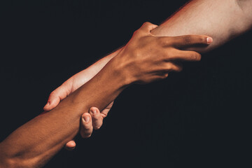 Black lives matter. Racial friendship. Multicolor male hands holding together isolated on dark copy...