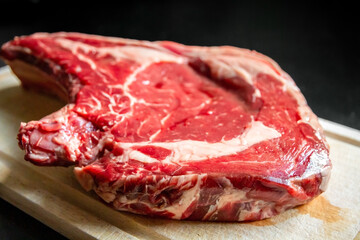 Beef prime rib on a cutting board