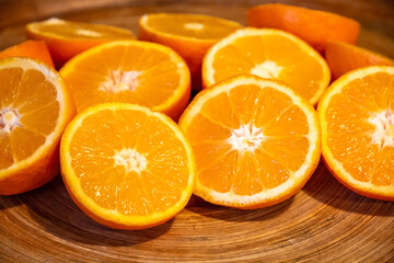 Bunch of fresh sliced oranges on a tray