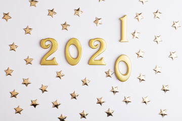 Happy New Year 2021. Sparkling gold numbers on white background with stars. object for design...
