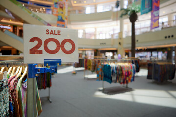 Close up view of sale tab with giant superstore on the background