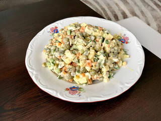 Traditional Russian Salad in Plate. Ready to Serve and Eat.